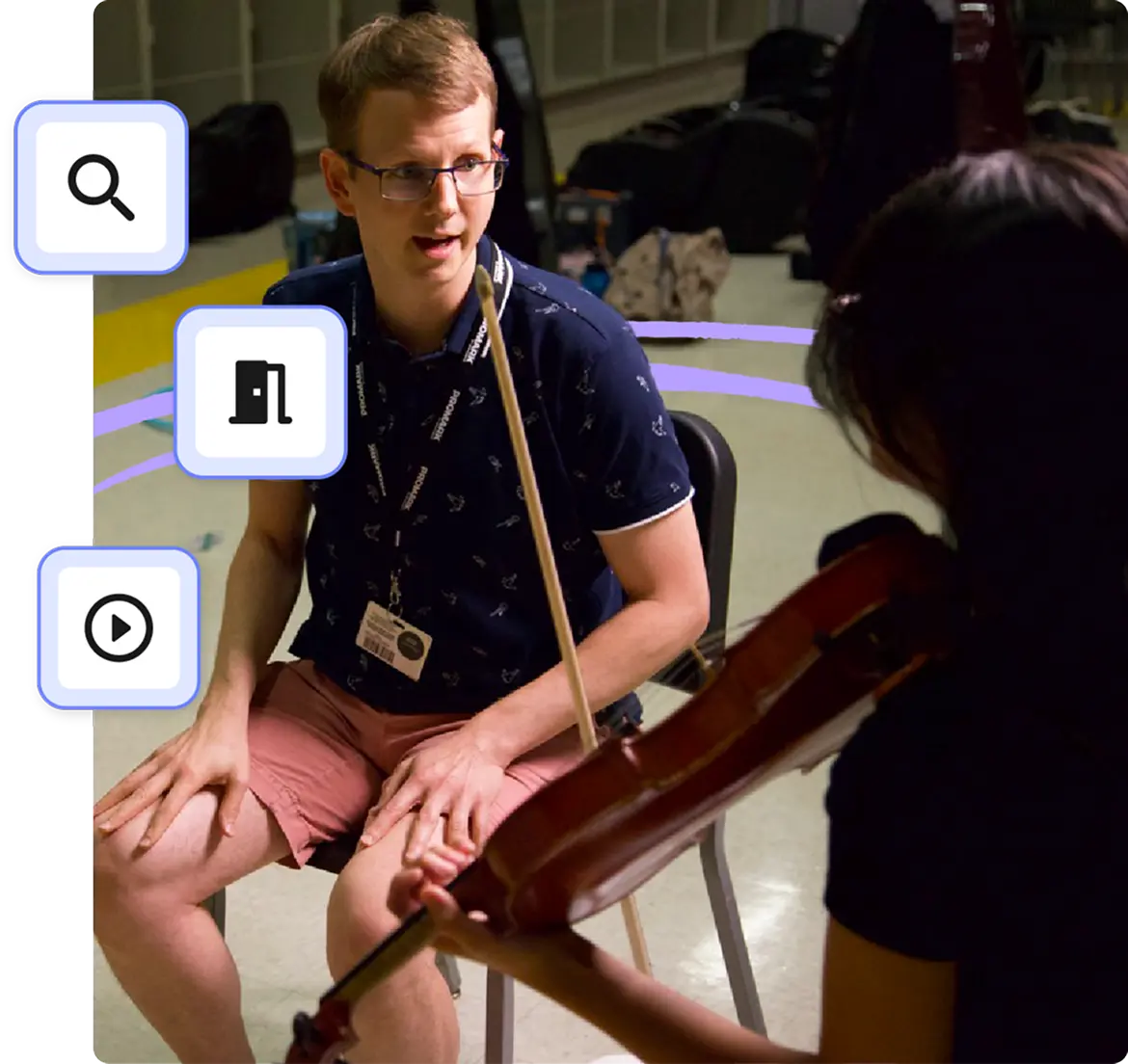 A MakeMusic instructor coaching a student on violin